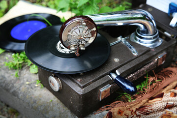 Old vintage record player with black plate