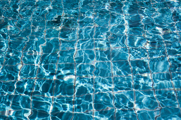 Ripple water in swimming pool background 