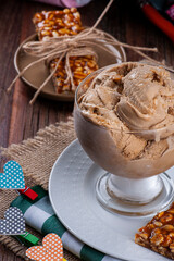 Peanut ice cream in a glass cup.