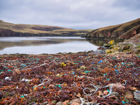 Plastic waste and pollution washed up on the remote beach of South Ham on Muckle Roe in Shetland, UK