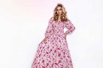 Spring fashion. Attractive blonde beauty in spring dress isolated on white. Spring concept....