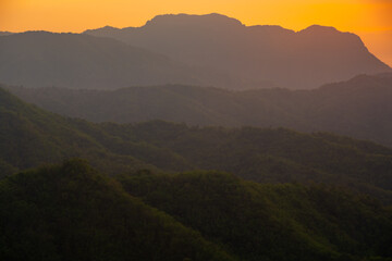 Naklejka premium beautiful sunset backlit in a valley