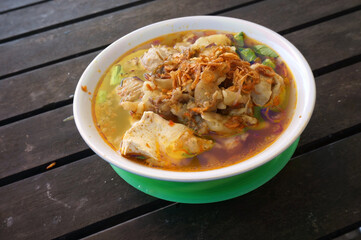 Bakso setan (Indonesian). Super spicy meatballs soup with noodles, Chicken feet, tofu and beef fat....