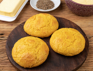 Broa, typical brazilian corn flour bread with ingredients. Butter, herbs and fuba, corn flour