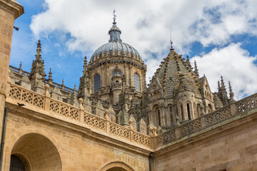 Fototapeta na wymiar Majestic detail view at the gothic ornaments building at the Salamanca cathedral, main facade and tower cupola dome