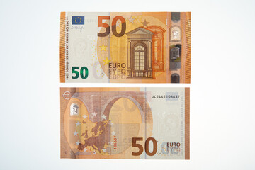 Both sides of a fifty euro banknotes on a white background