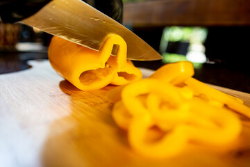 cutting yellow pepper