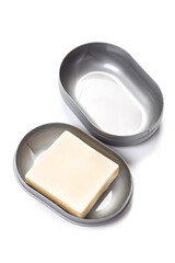 Travel soap in plastic soap dish isolated on white background