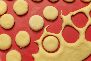 circles of dough cut on a silicone dough mat