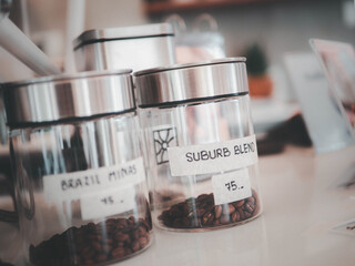 Coffee in glass jars on a table.Coffee beans.