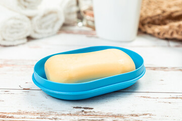 soap on a blue soap dish isolated on a white background. hygiene concept