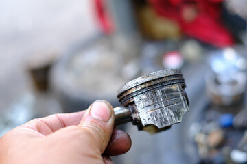Damaged motorcycle engine piston rings from use.