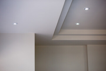 The walls and ceiling have just been painted white. Construction work of a bricklayer in Thailand. Background image