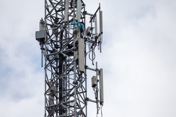 transmitter atop a cell phone pole About to be upgraded from 4g to 5g. High-risk electrical...