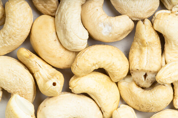 background - many raw cashew seeds