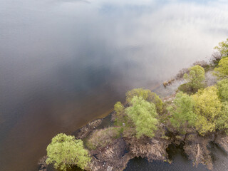 River bank in spring. Aerial drone view.