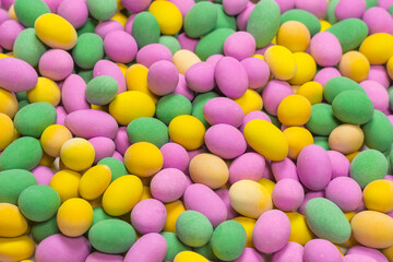 Group of colorful peanuts in glaze.