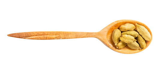 view of wood spoon with cardamom seeds isolated