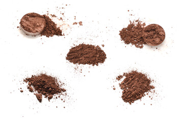 Makeup cosmetics. Eyeshadow in brown color crushed palette, colorful eye shadow powder on white background