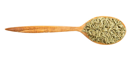 top view of wood spoon with anise seeds isolated
