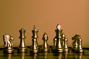 Closeup of chess characters on board games. to represent decision making in term of business strategy to find out the best solution to meet target objective and goal.