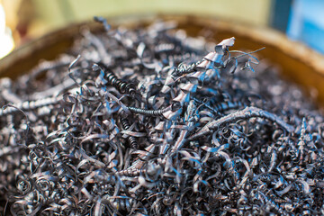 Closeup machined steel  twisted spiral steel in tank