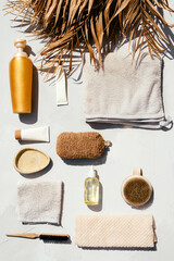 Fototapeta na wymiar Beautiful photo of spa and skin care products such as oil, cream and other organic products, towels shot in flat lay style on sunlight with contrast shadows