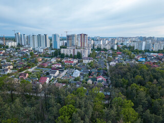 Obraz premium Forest on the outskirts of the city. Aerial drone view.