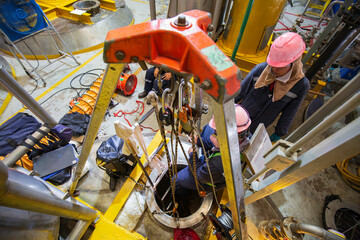 Top view male climb up the stairs into the tank stainless chemical area confined space save lives with rescue rope © chitsanupong