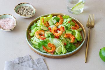Salad with shrimp, cucumbers and avocado. Healthy eating. Vegetarian food.