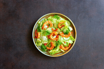 Salad with shrimp, cucumbers and avocado. Healthy eating. Vegetarian food.
