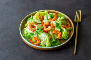 Salad with shrimp, cucumbers and avocado. Healthy eating. Vegetarian food.