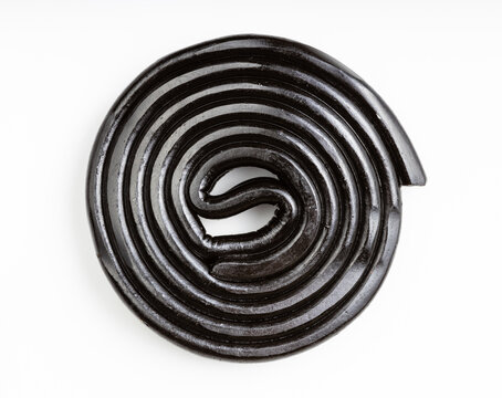 top view of spiral from liquorice candy on white