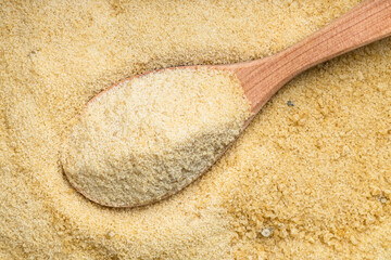 view of wood spoon with granulated coconut sugar