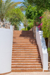 Detail of stairs and white wall of a house on the street of Egypt in Sharm El Sheikh