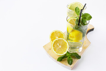 cocktail of lemons and mint on a wooden board close-up