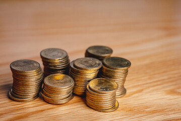 Gold coins stacks is representing riches and wealth management. Coin stack growing and find out the way to get a return on investment. Finance and money exchange investment as concept.