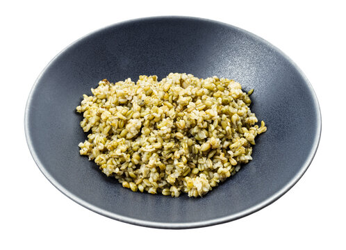 cooked porridge from freekeh wheat grains in bowl