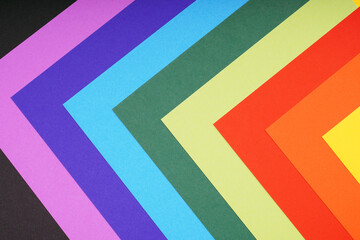 rainbow colored paper background with angular pattern