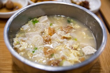 Light pollock soup with tofu, egg and green onion in dried pollack, traditional Korean food - obrazy, fototapety, plakaty