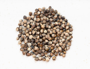pile of monk's pepper (vitex) close up on gray