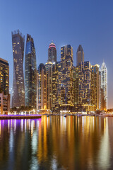 Dubai Marina skyline architecture buildings travel at night twilight in United Arab Emirates portrait format