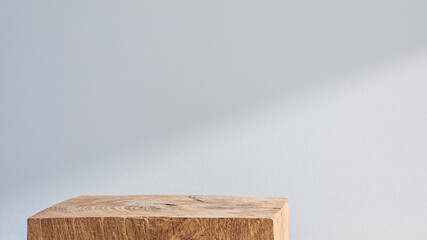 Wooden cubic podium on a white background with shadow