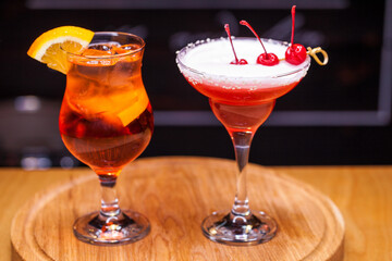 Alcoholic cocktail on wooden board