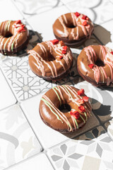 Homemade Chocolate Donuts with chocolate coating. National Donut Day. Homemade baking.