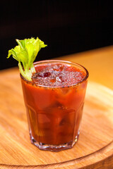 Alcoholic cocktail on wooden board