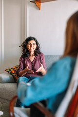 psychology and mental therapy concept - spanish woman patient and psychologist at psychotherapy session