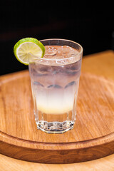 Alcoholic cocktail on wooden board