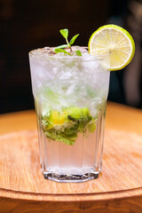 Alcoholic cocktail on wooden board