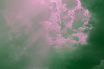 Sunbeams making their way through thunderclouds